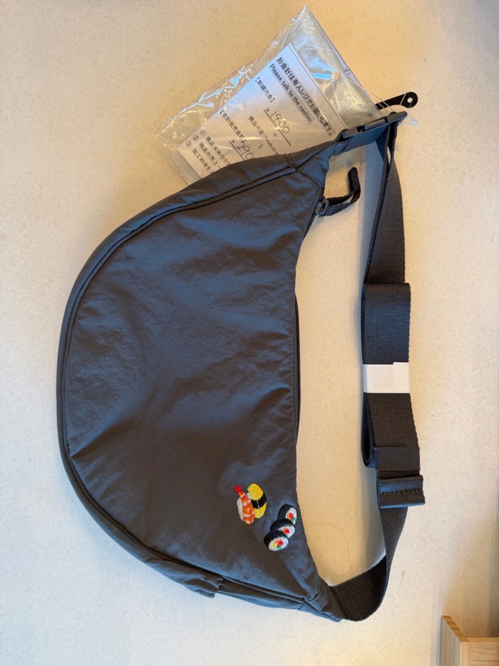 Uniqlo round mini shoulder bag dark grey sushi embroidery